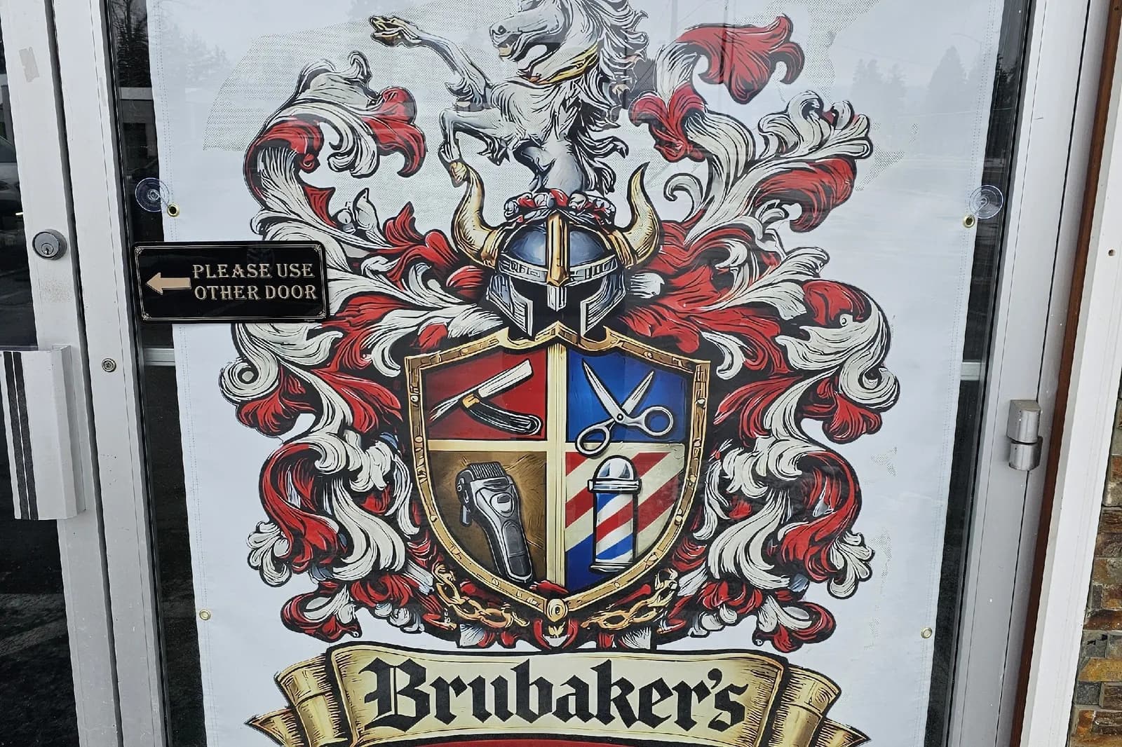 The shop door with the Brubaker's crest banner